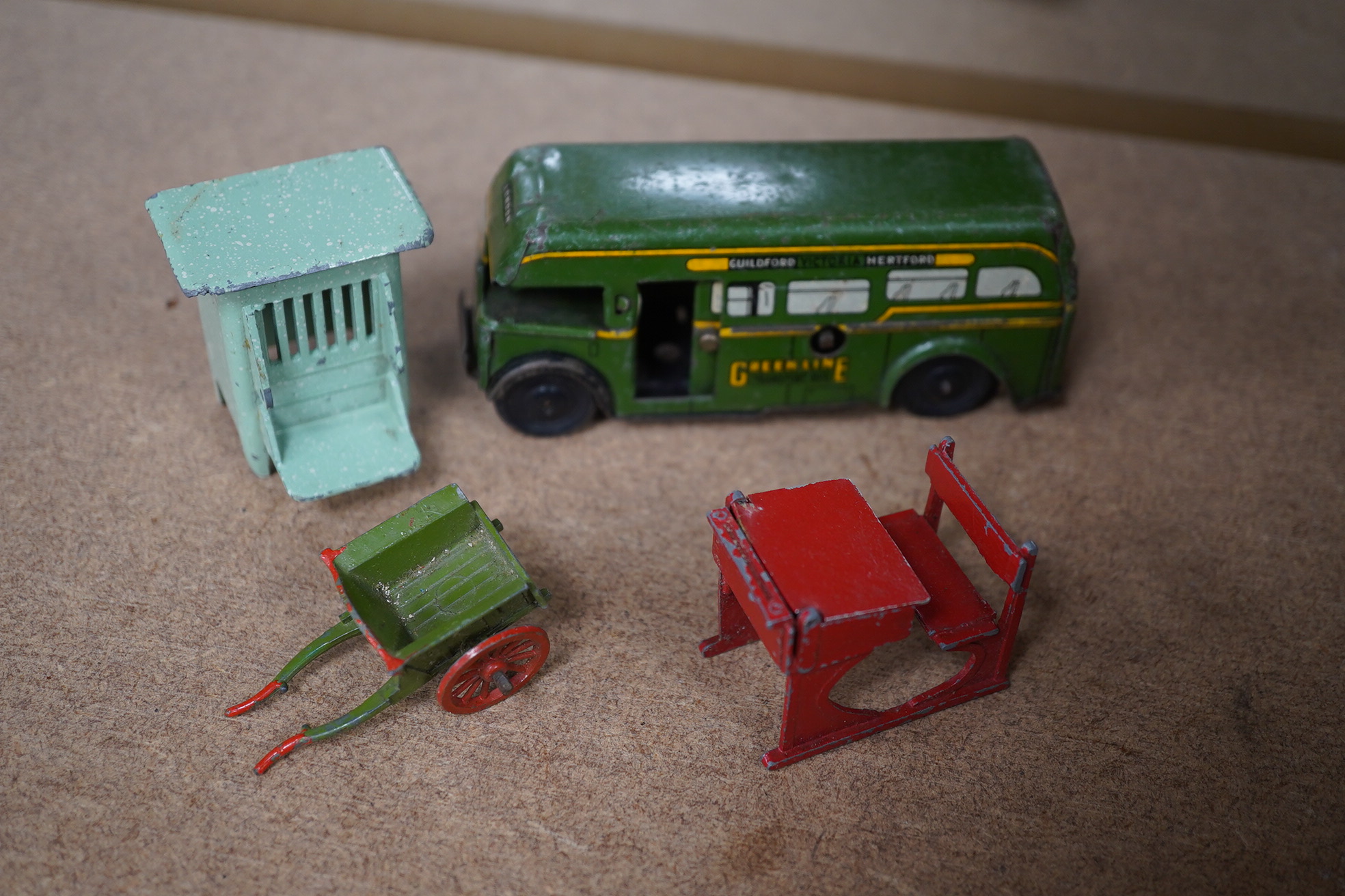 A group of various tinplate and other toys including Britains and Dinky and a 20th century straw filled dog. Condition - poor to fair